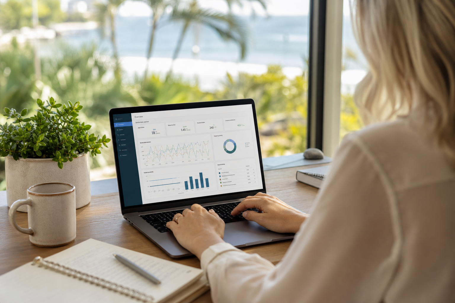Gold Coast small business owner reviewing IT dashboard on a laptop